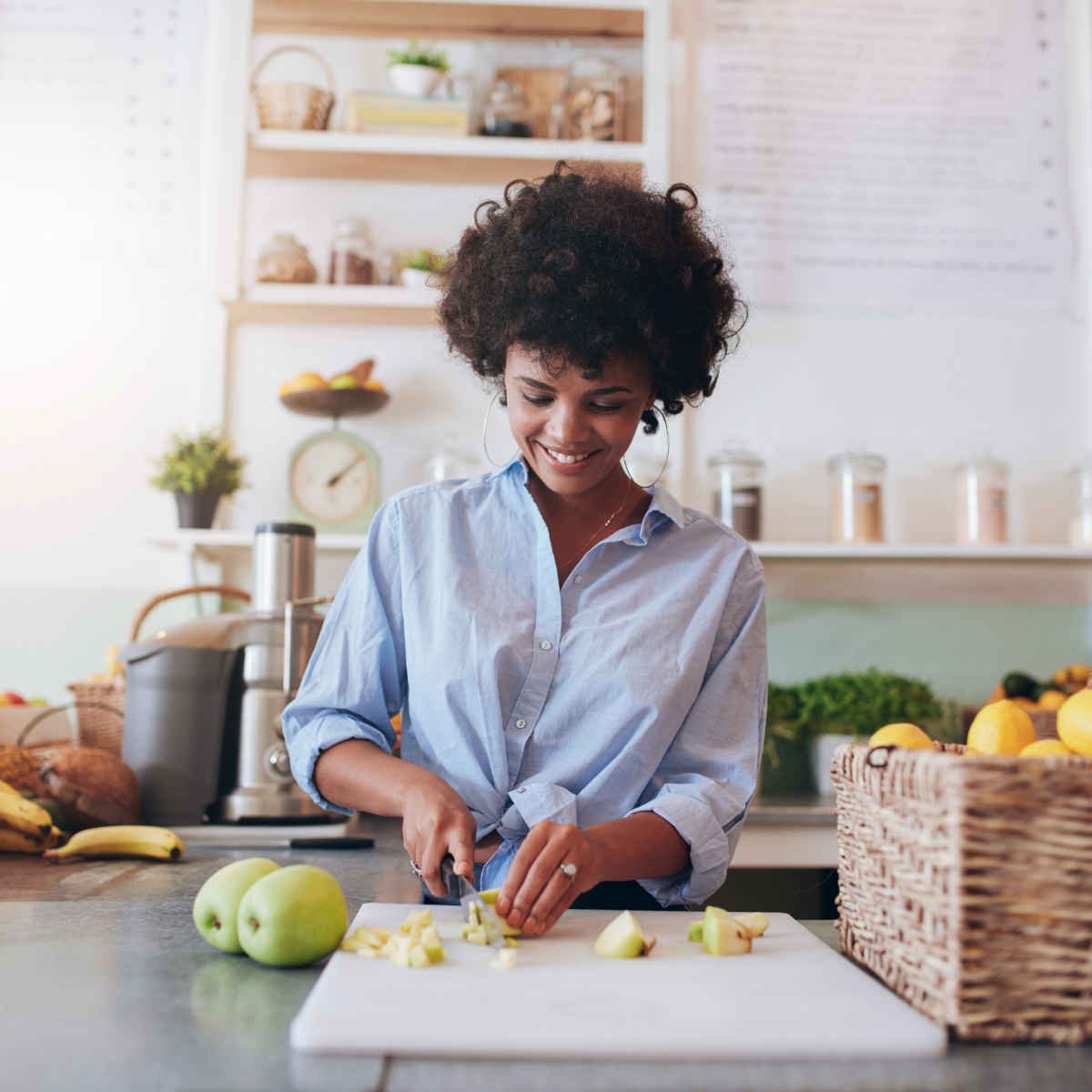 Young woman making fresh juice